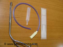 Re-routing catheter, silicone oil, adhesive dressing and Magill's forceps