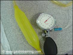 Reusable achalasia dilatation balloon with the pressure gauge: the endoscope goes through the top end of the yellow tube and comes out below the balloon